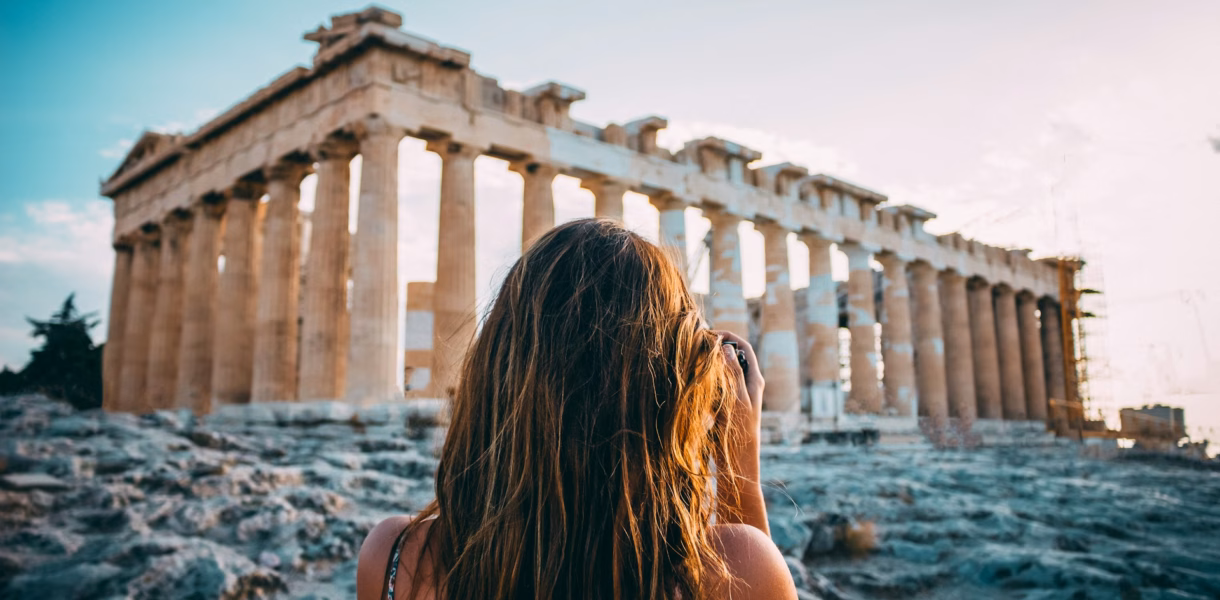 women at parthenon: athens expensive city