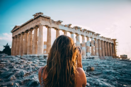 women at parthenon: athens expensive city
