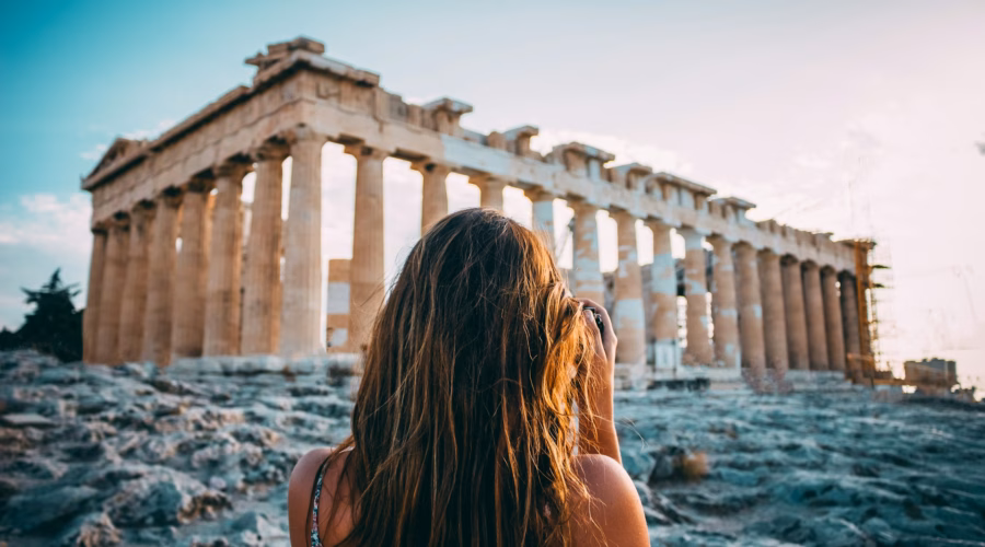 women at parthenon: athens expensive city
