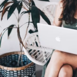 a girl that works on a computer as a digital nomad