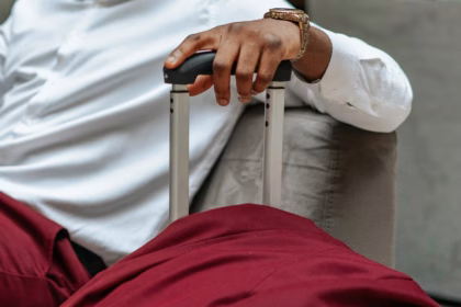 a man holding a hand luggage