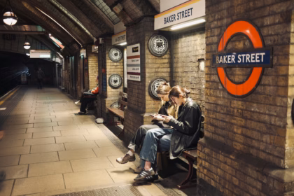 people sitting on a bench in London Underground