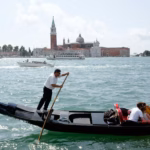 tourists on gondola in venice