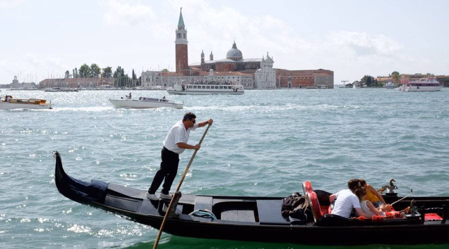 tourists on gondola in venice