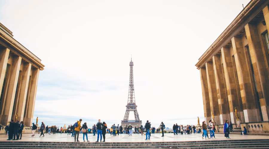 tourists with eiffel tower in backgrond in paris: a safe city