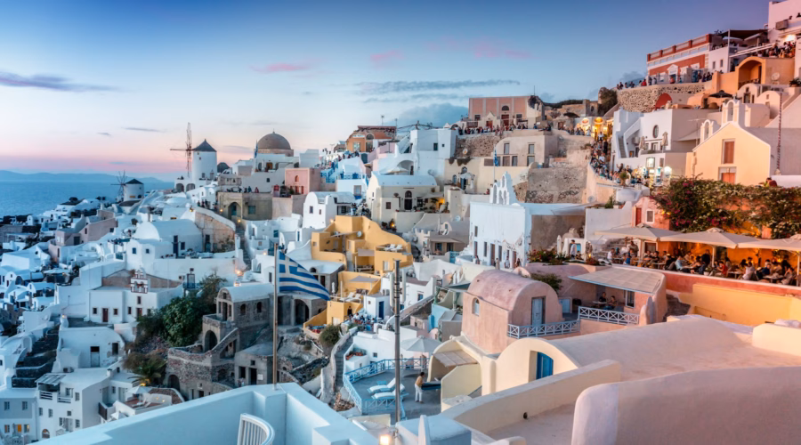 Best places to travel in June 2025 - sunset over Santorini, Greece