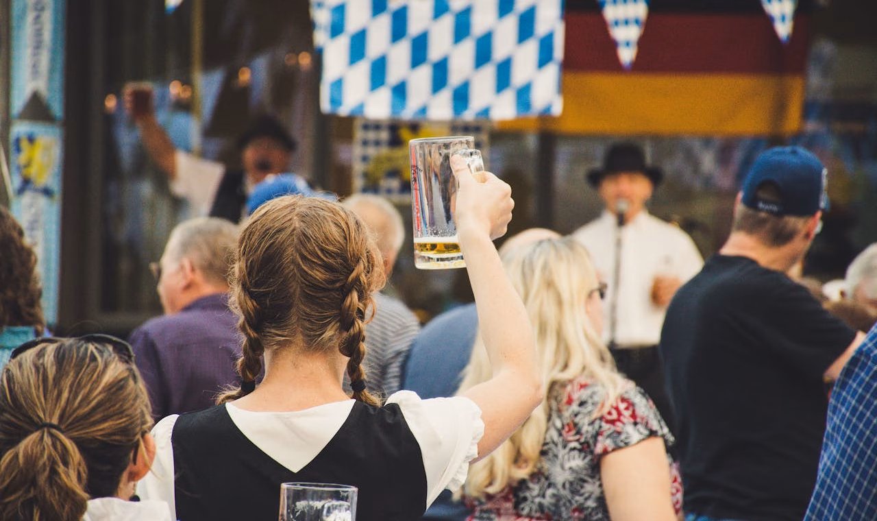 oktoberfest 2025: people celebrating with beer