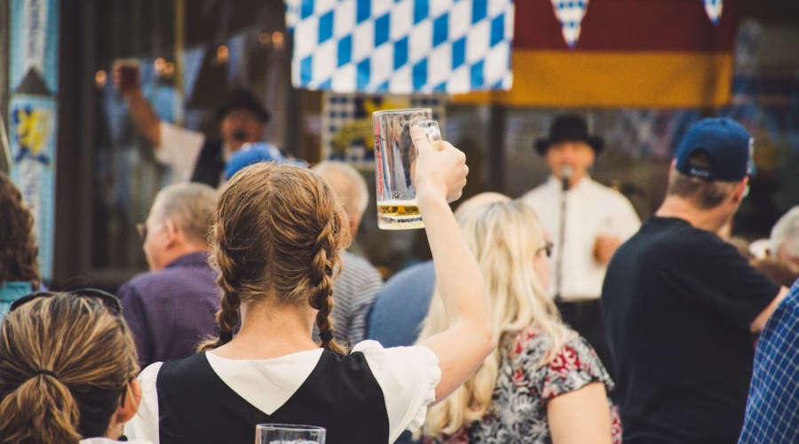 oktoberfest 2025: people celebrating with beer