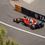 A formula 1 car speeds around a racetrack.