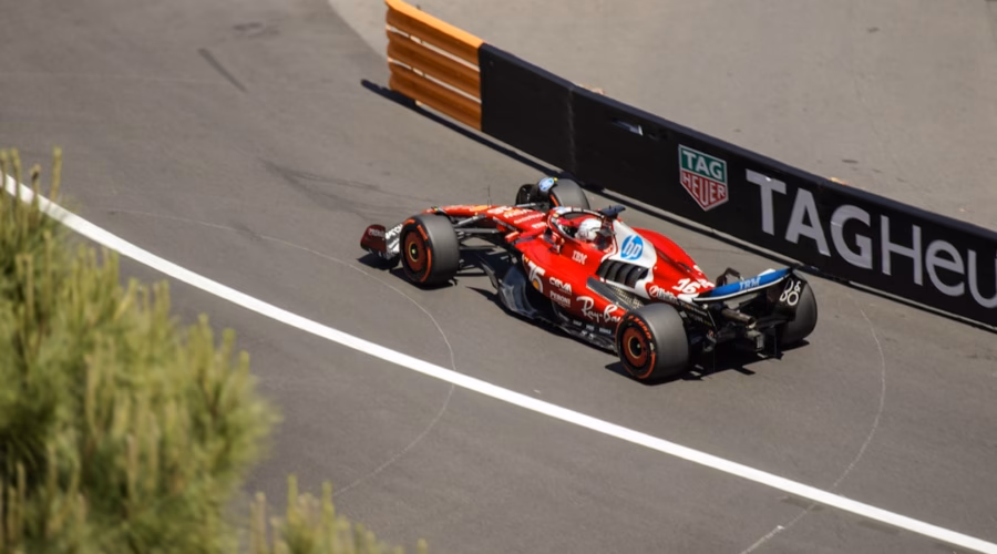 A formula 1 car speeds around a racetrack.