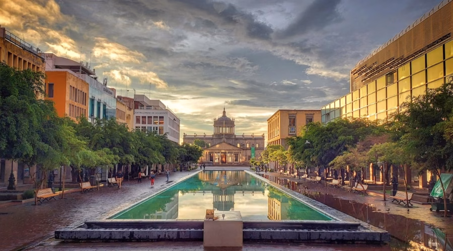 a city square with a fountain in the middle of it