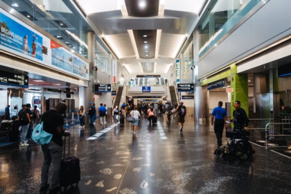 a group of people walking through an airport