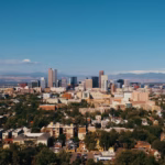 a view of a city with mountains in the background