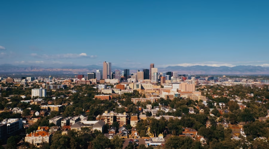 a view of a city with mountains in the background
