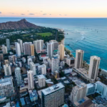 an aerial view of a city by the ocean