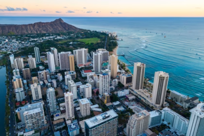 an aerial view of a city by the ocean