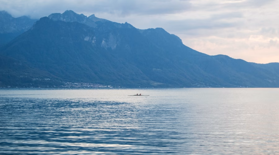 a lone boat in the middle of a large body of water