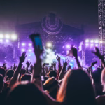 group of people raising there hands in concert
