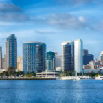 City skyline with boats on the water.