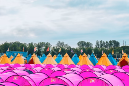 a large group of pink tents sitting next to each other
