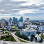 an aerial view of a city with tall buildings