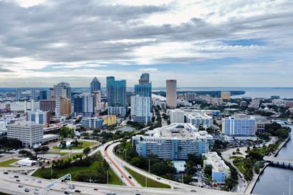 an aerial view of a city with tall buildings