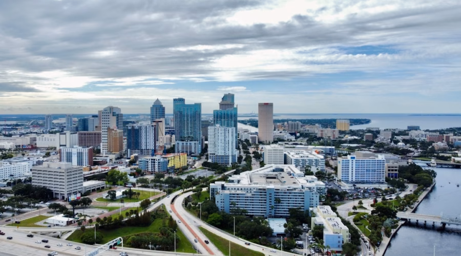 an aerial view of a city with tall buildings