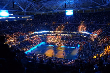 Crowd inside an indoor tennis arena during a match