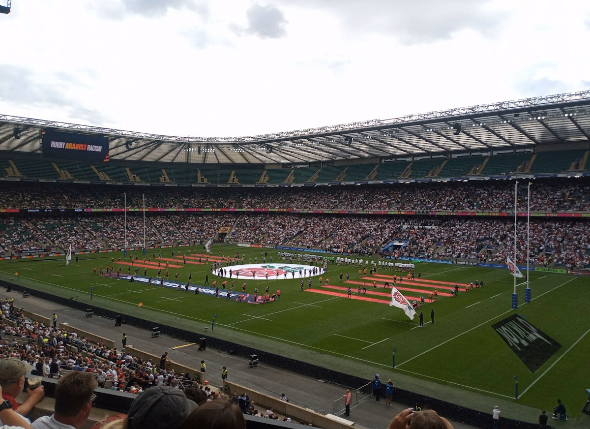 Packed rugby stadium crowd during an international match
