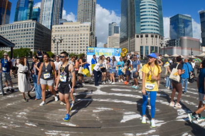 Runners gathered for the Chicago Marathon 2026 with the city skyline behind