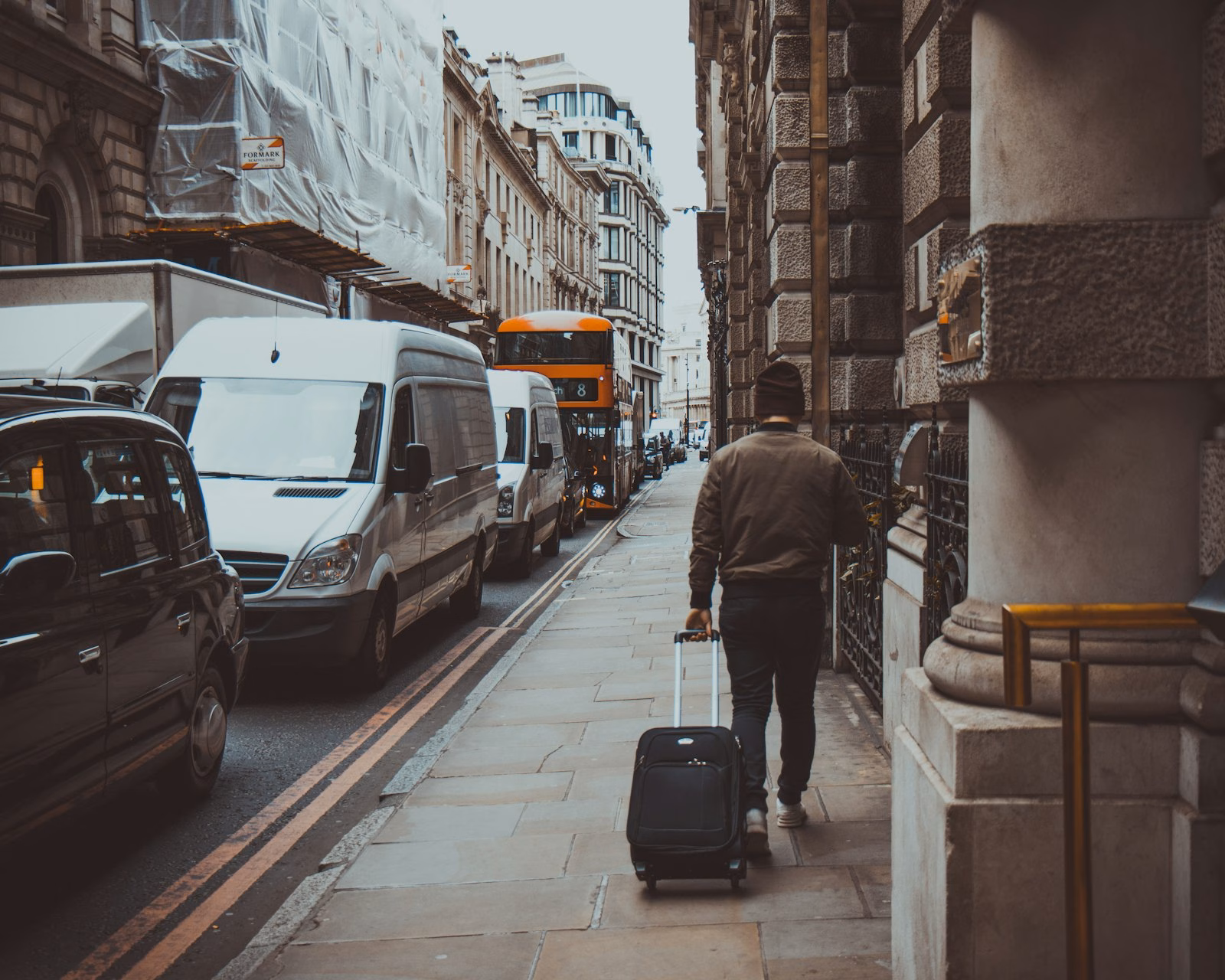 Traveler with luggage in Manhattan during New York Fashion Week
