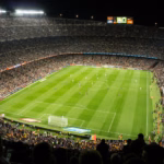 Allianz Stadium Turin guide: fans watching an evening football match under floodlights