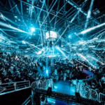Lanxess Arena Cologne guide: concert crowd under blue stage lights in an indoor arena