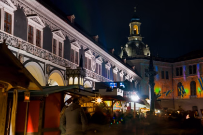 Christmas market stalls lit up at night in Dresden