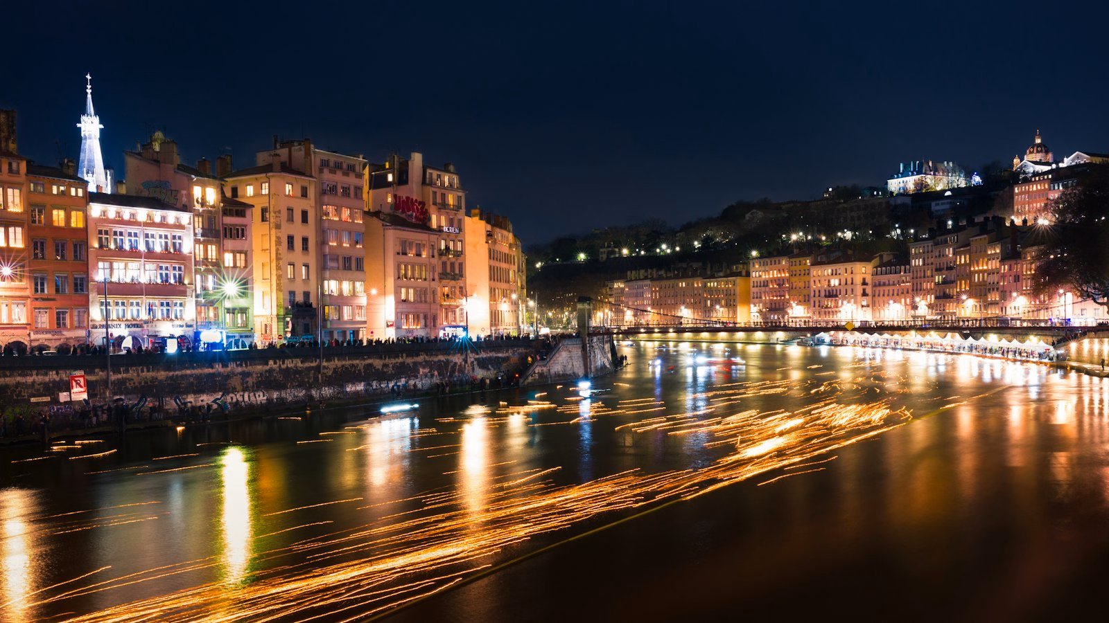 Illuminated buildings in Lyon at night during the Fete des Lumieres Lyon season