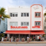 Art deco hotel with palm trees in Miami Beach