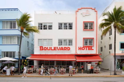 Art deco hotel with palm trees in Miami Beach