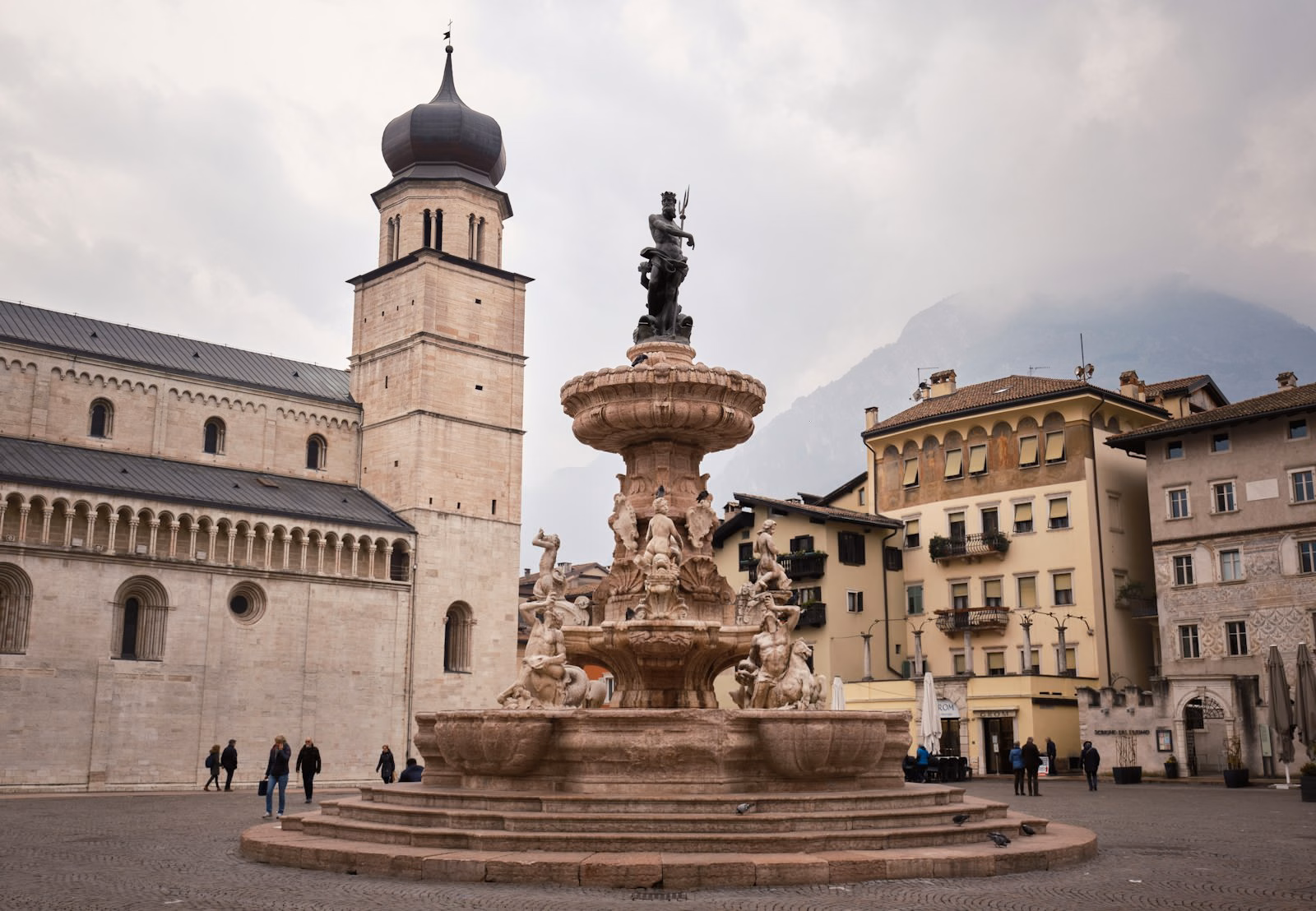 Neptune fountain and clock tower in Piazza Duomo, near the Trento Christmas market