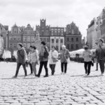 St. Martin's Day in Poznań: people walking across a city square in Poznań