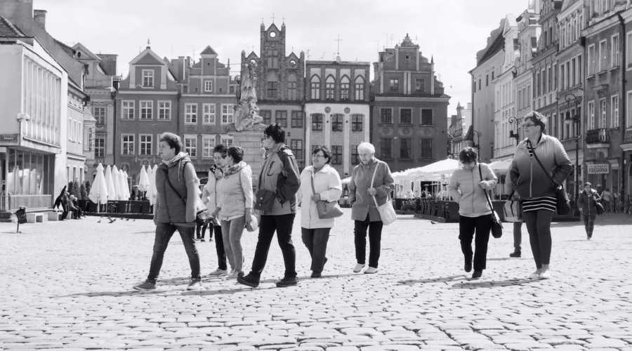 St. Martin's Day in Poznań: people walking across a city square in Poznań