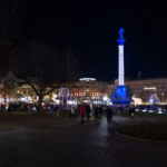 Visitors walking through the Stuttgart Christmas market at night