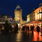 Crowds walking through Valkenburg town centre at night