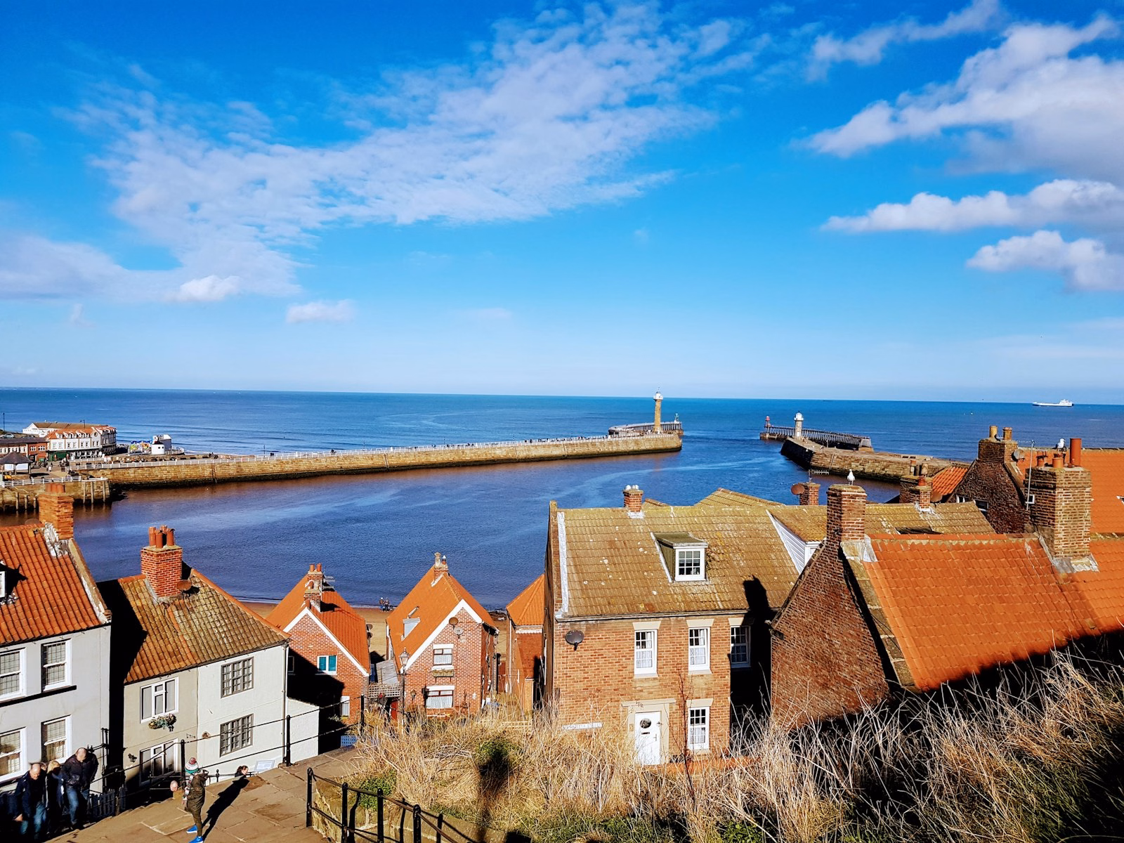 Whitby harbour and old town houses by the sea, North Yorkshire