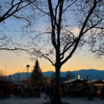 People gathered around a decorated Christmas tree in Zurich